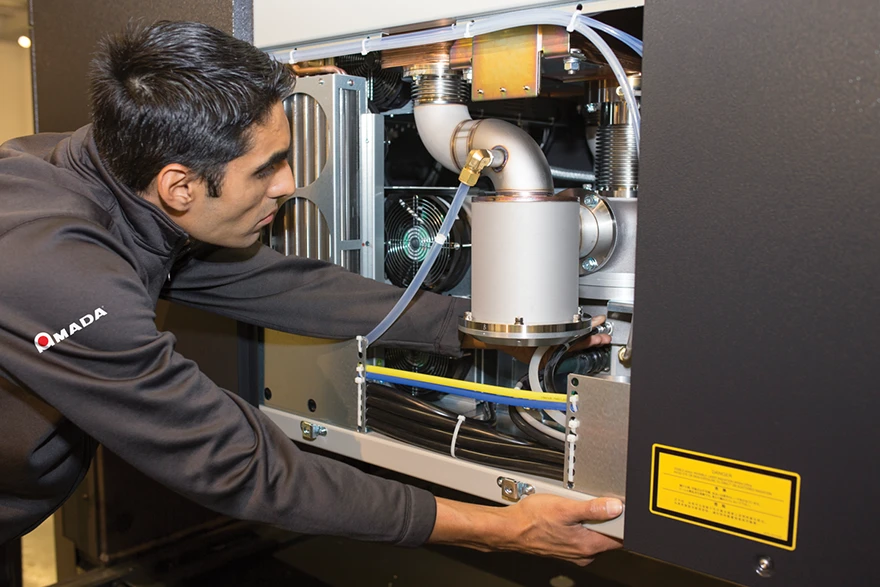 Technician servicing Amada Machinery
