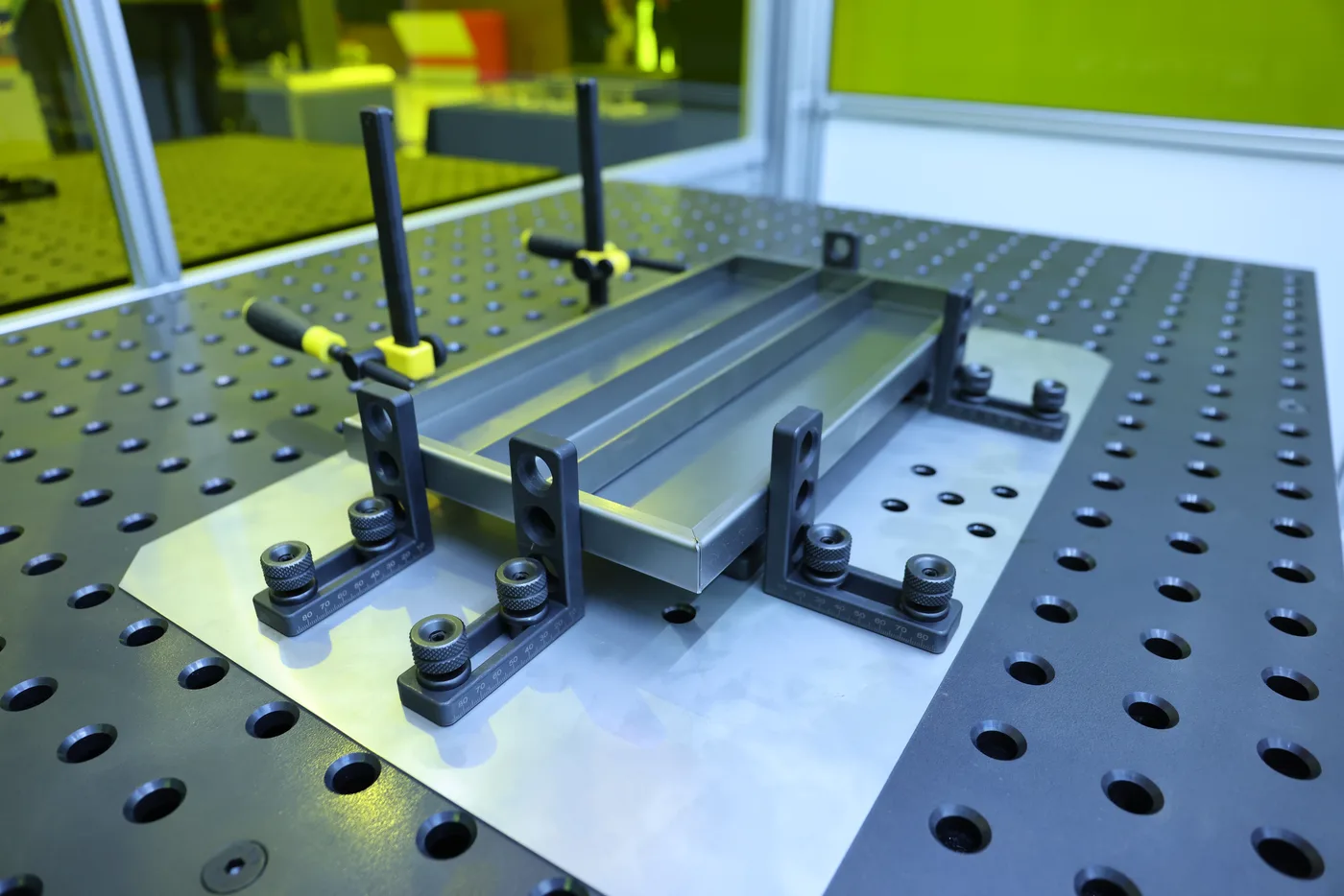 Sheet metal assembly clamped in modular welding fixturing
